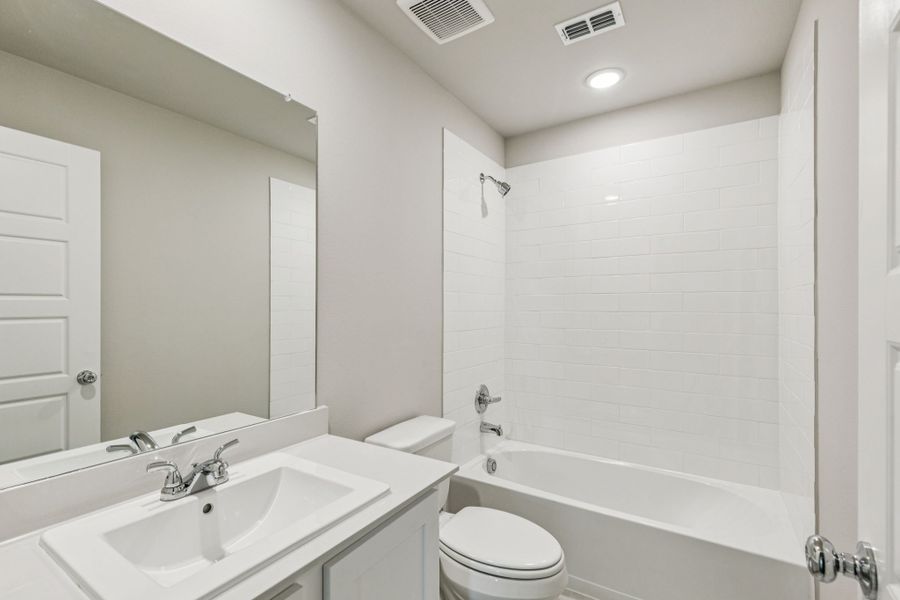 Bathroom in the Harper home plan by Trophy Signature Homes – REPRESENTATIVE PHOTO