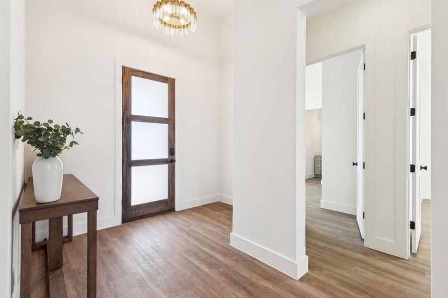 Wide-Plank Wood Flooring Welcomes You in the Entry