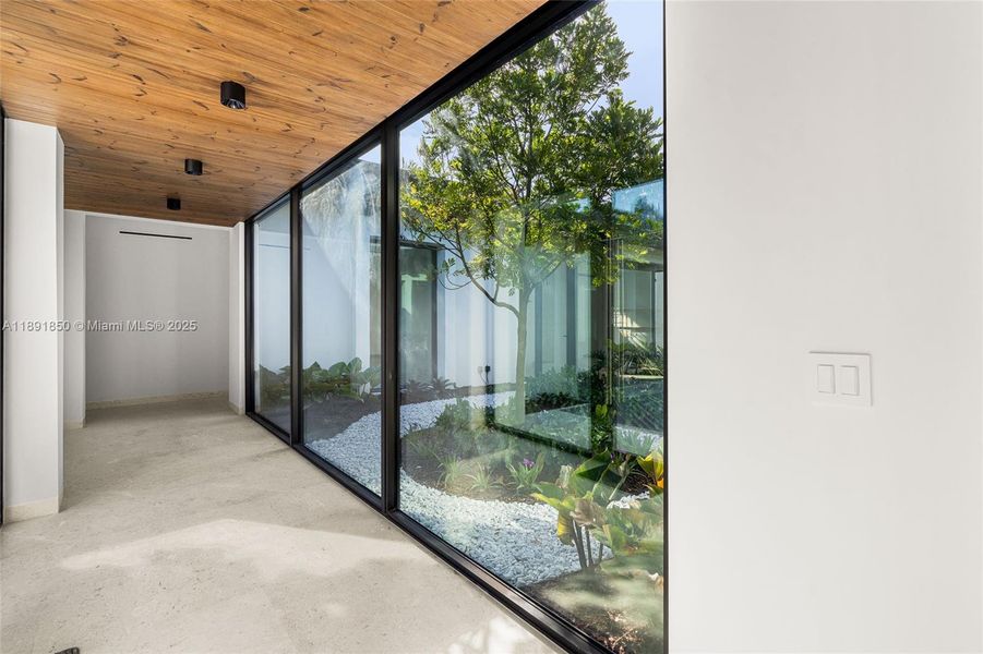 Exterior details and patio area of a home in , Coral Gables (Image 23).