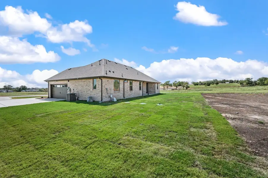 Exterior details and patio area of a home in Gatlin Ranch, Springtown (Image 21).