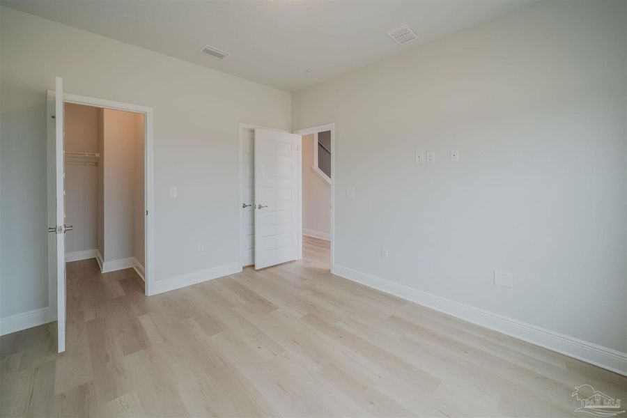 Representative unfurnished interior of a home built from the Plan 1767 Townhome by Adams Homes in Lexlee Estates, Pensacola (Image 8). Representative unfurnished interior of a home built from the Plan 1767 Townhome by Adams Homes in Lexlee Estates, Pensacola (Image 8).
