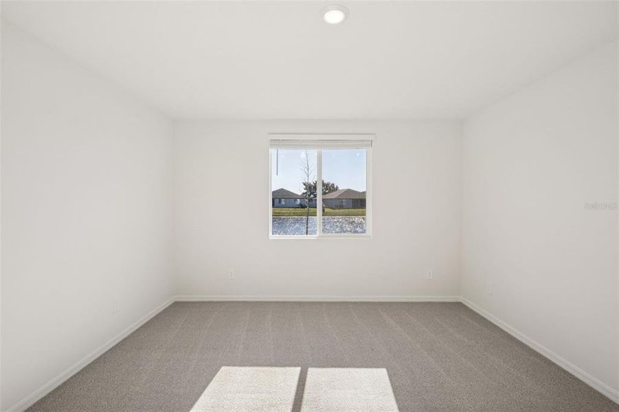 Spacious, unfurnished interior of a new home in The Grove at Stuart Crossing - Classic Series, Bartow (Image 30).