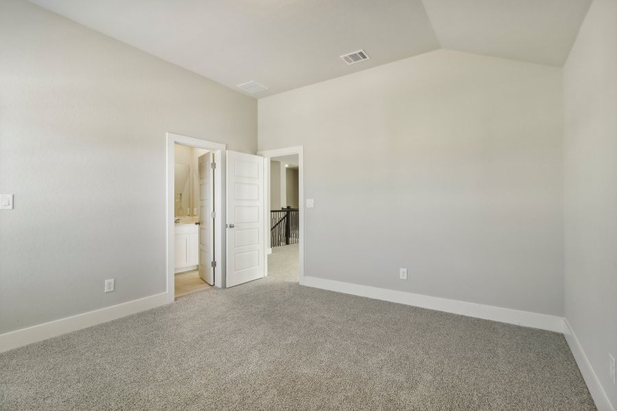 Guest bedroom in the Cedar floorplan at a Meritage Homes community.