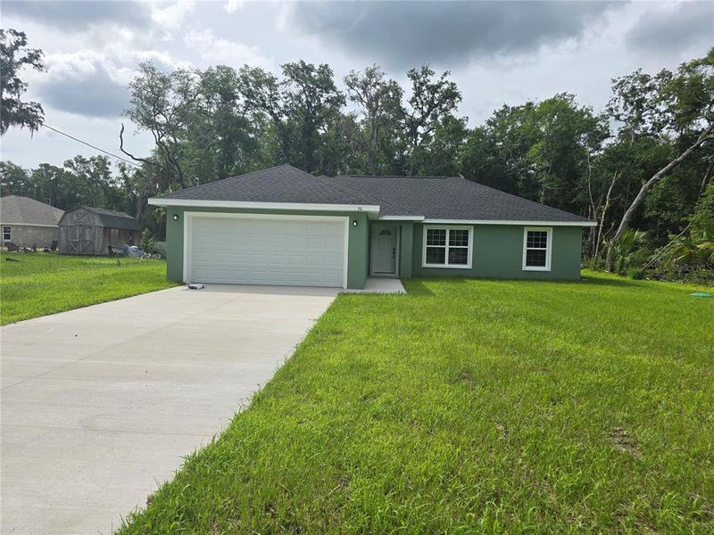 Front exterior of a new home in , Ocklawaha, FL, highlighting curb appeal (Image 19). Front exterior of a new home in , Ocklawaha, FL, highlighting curb appeal (Image 19).