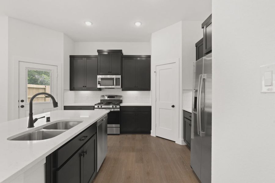 Representative furnished interior of a home built from the Cheverny by Chesmar Homes in The Woodland Hills Chateau, Willis (Image 7).
