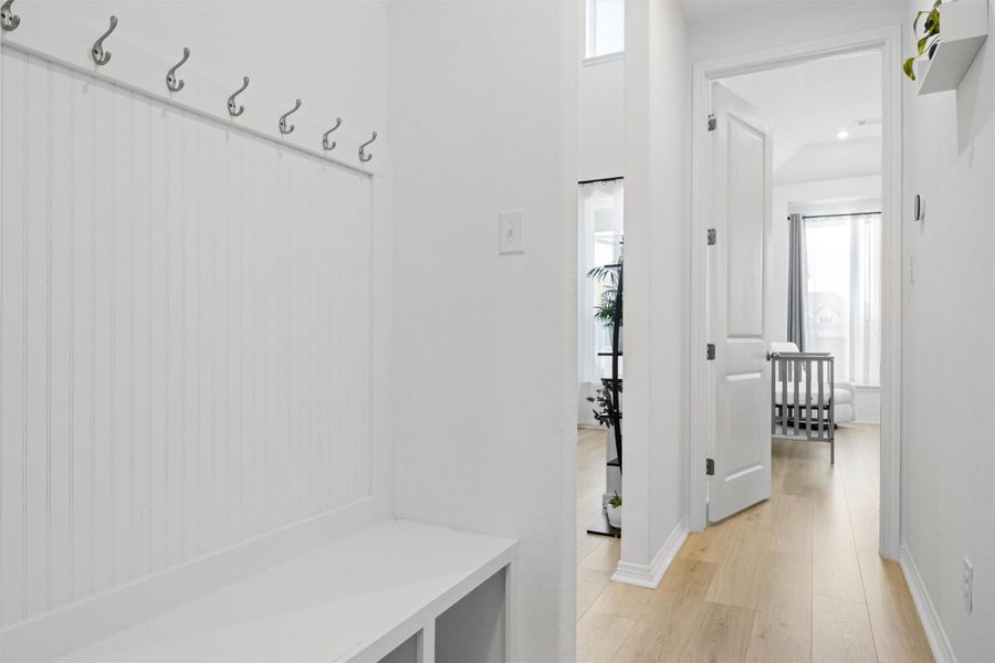 Mudroom featuring light wood-style flooring and baseboards Mudroom featuring light wood-style flooring and baseboards