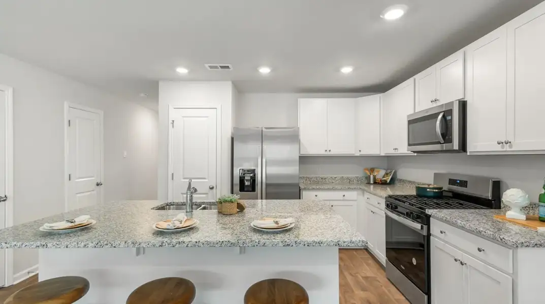 Furnished interior view inside a new home in Pine Hills Townhomes at Cane Bay, Summerville (Image 2).