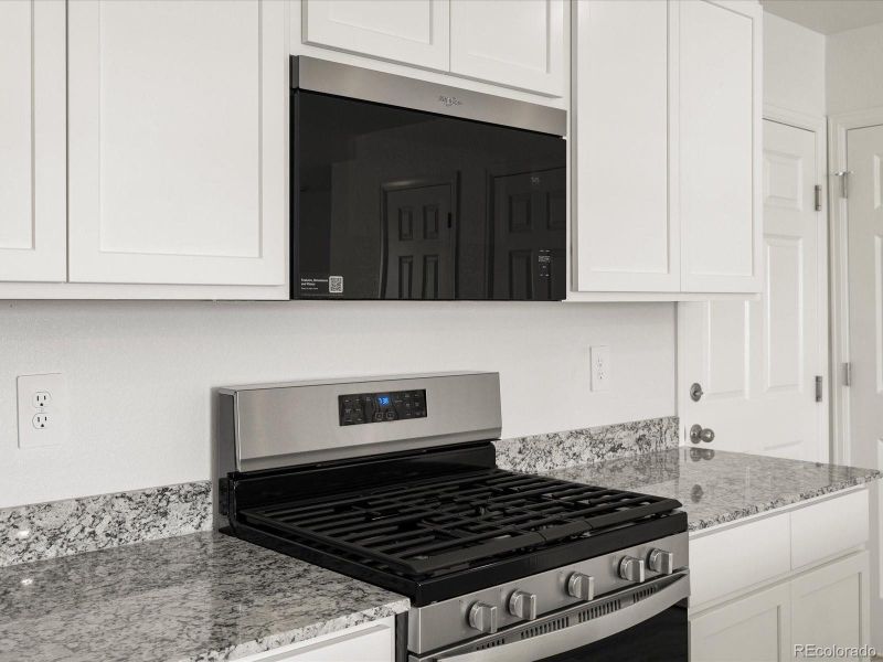 Furnished interior view inside a new home in Skyview at High Point, Aurora (Image 8).