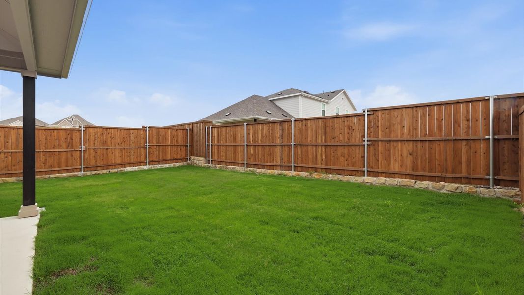 Exterior details and patio area of a home in Westridge Journey, Princeton (Image 24).