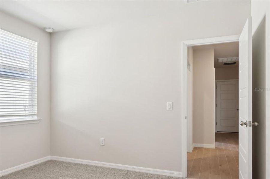 Spacious, unfurnished interior of a new home in Crescent Lakes - Premier Series, Punta Gorda (Image 16).