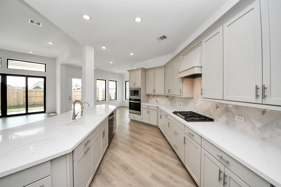 Furnished interior view inside a new home in ARTAVIA: Hilltop Collection, Conroe (Image 4).