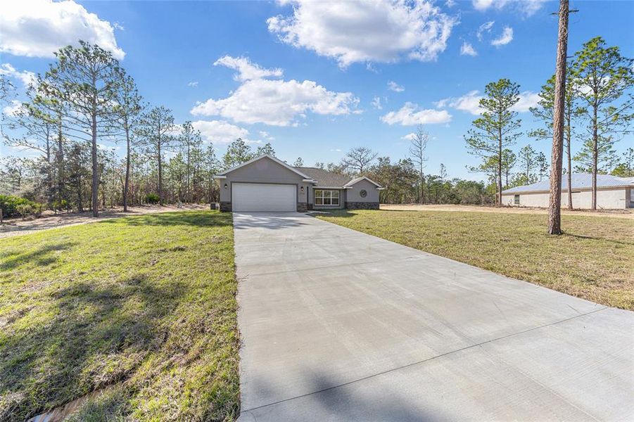 Front exterior of a new home in , Ocala, FL, highlighting curb appeal (Image 21). Front exterior of a new home in , Ocala, FL, highlighting curb appeal (Image 21).