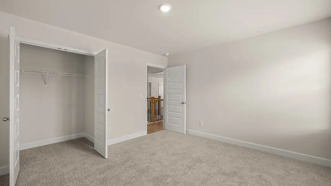 Representative unfurnished interior of a home built from the Hampshire by D.R. Horton in Heritage Pointe, Senoia (Image 35).