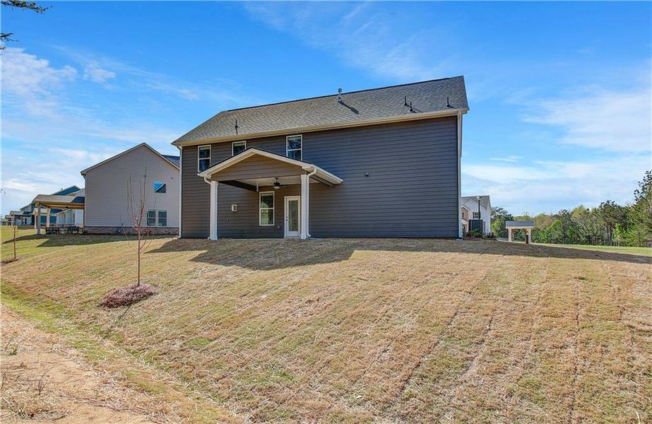Front exterior of a new home in Copperfield, Locust Grove, GA, highlighting curb appeal (Image 2).