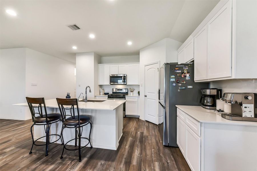 Furnished interior view inside a new home in Sunterra, Katy (Image 6).