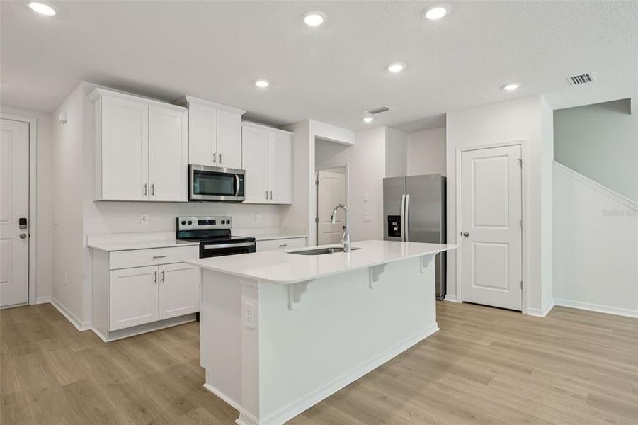 Furnished interior view inside a new home in Bradford Park, Ormond Beach (Image 5).