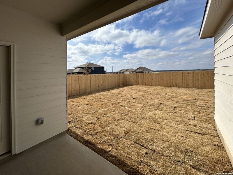 Exterior details and patio area of a home in Hennersby Hollow, San Antonio (Image 20).