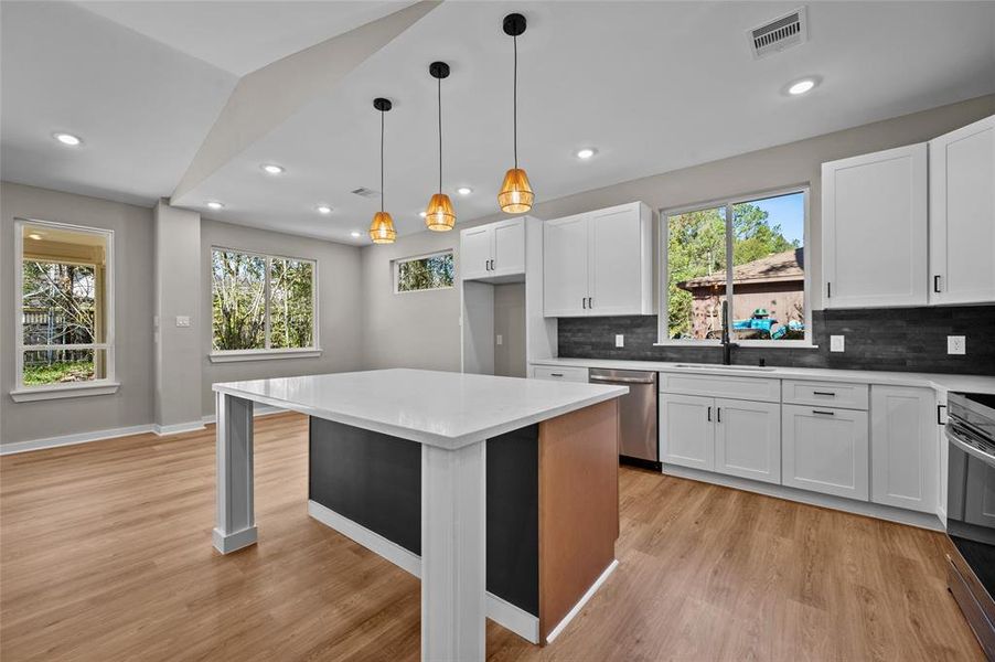 Nice open space with pendulum lights and lots of natural light.