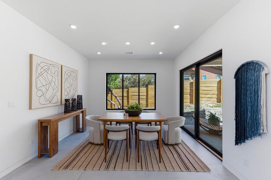 Dining space featuring recessed lighting and light tile patterned floors