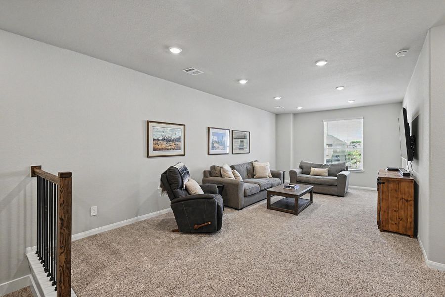 The game room offers an outdoor view and soft carpet flooring, creating a comfortable space for children to play. The game room offers an outdoor view and soft carpet flooring, creating a comfortable space for children to play.