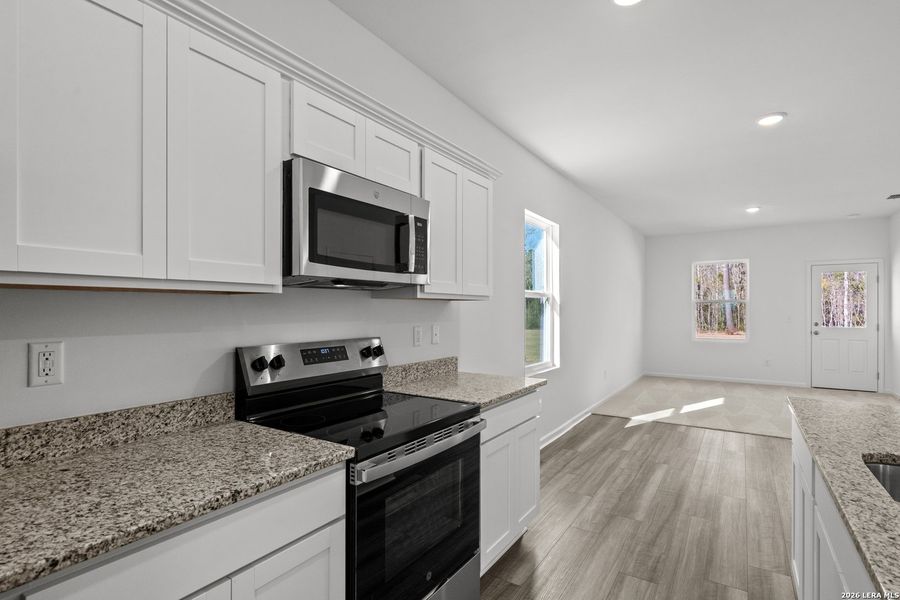 Furnished interior view inside a new home in Sutton Farms, San Antonio (Image 8).