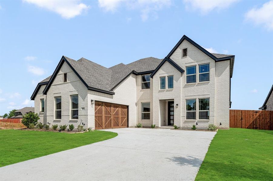 Front exterior of a new home in The Oaks, Red Oak, TX, highlighting curb appeal (Image 26). Front exterior of a new home in The Oaks, Red Oak, TX, highlighting curb appeal (Image 26).