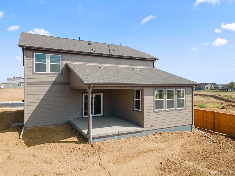 Front exterior of a new home in , Brighton, CO, highlighting curb appeal (Image 1).