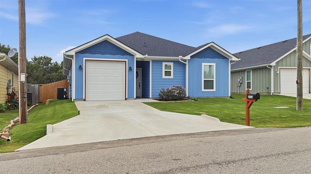 Front exterior of a new home in , Granbury, TX, highlighting curb appeal (Image 2). Front exterior of a new home in , Granbury, TX, highlighting curb appeal (Image 2).