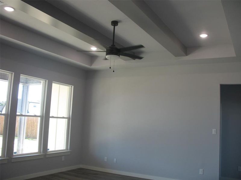 Unfurnished room with a ceiling fan, beamed ceiling, dark wood-style floors, and recessed lighting