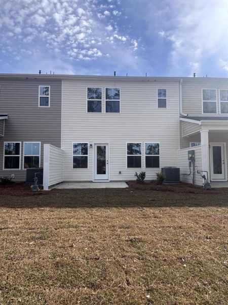 Exterior details and patio area of a home in Lindera Preserve at Cane Bay Plantation: Townhomes, Summerville (Image 3). Exterior details and patio area of a home in Lindera Preserve at Cane Bay Plantation: Townhomes, Summerville (Image 3).