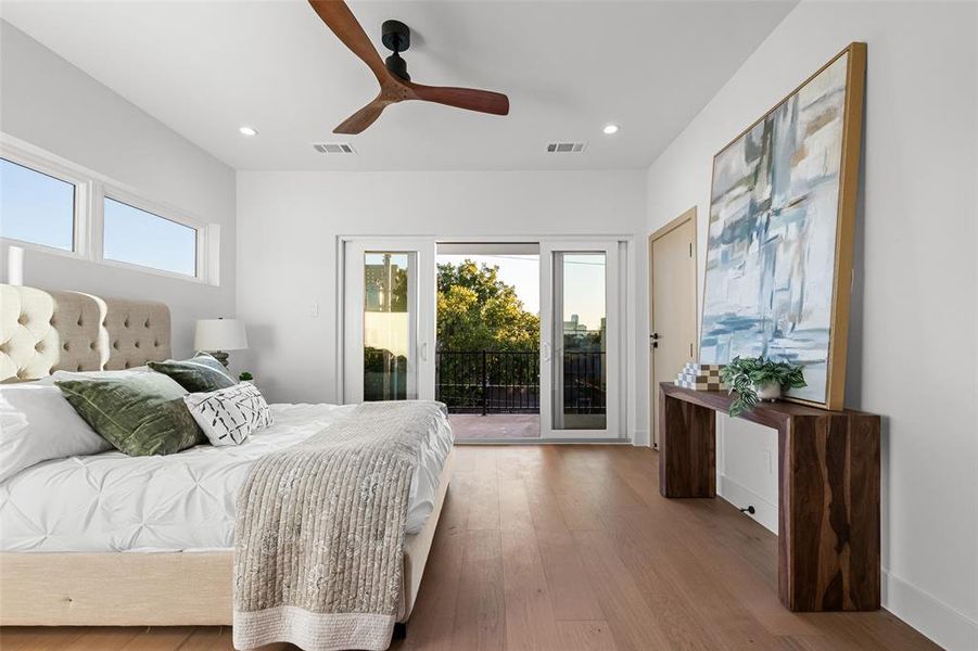 Bedroom with access to outside, wood finished floors, a ceiling fan, and recessed lighting