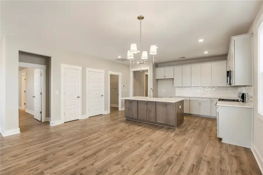 A luminous open-concept space features a well-appo