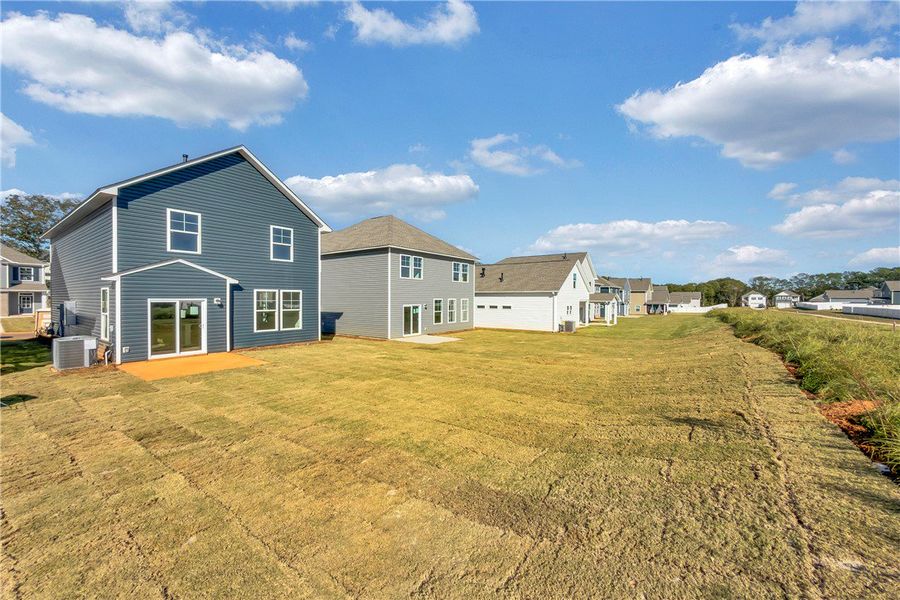 Exterior details and patio area of a home in Brownstone Park, Easley (Image 3).