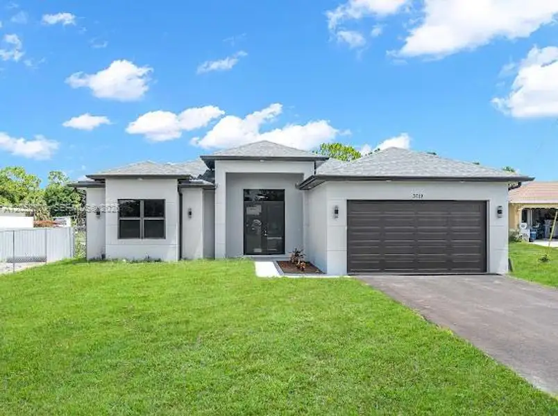 Front exterior of a new home in , Naples, FL, highlighting curb appeal (Image 1). Front exterior of a new home in , Naples, FL, highlighting curb appeal (Image 1).