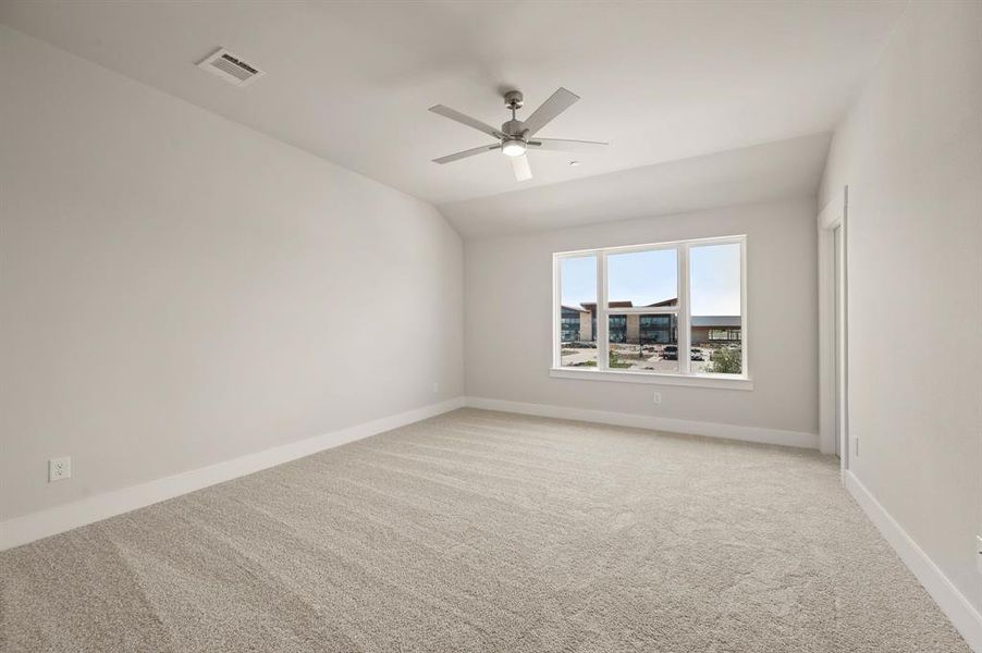 This dreamy owner's bedroom offers plenty of space and natural light.