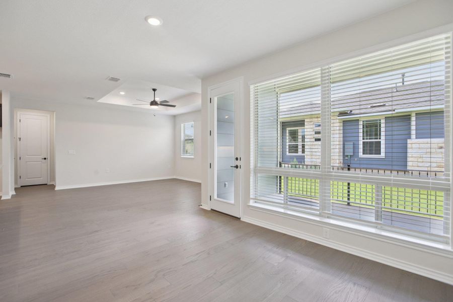 Empty room featuring light wood finished floors, recessed lighting, and ceiling fan