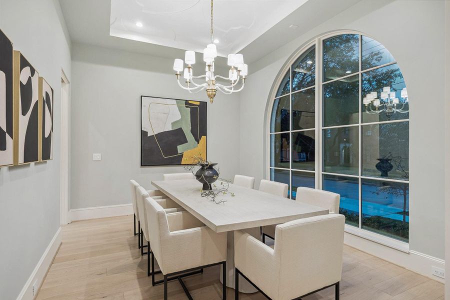 [Formal Dining] The formal dining room features rich hardwood floors with access to the scullery/catering kitchen. Chapman and Meyers Crystal Cube chandelier.