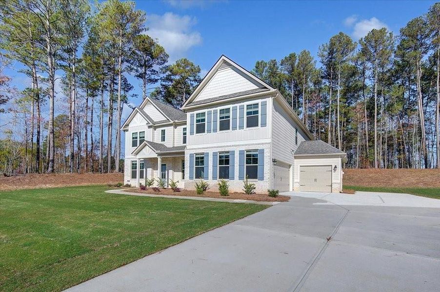 Front exterior of a new home in Riverbend Overlook, Fayetteville, GA, highlighting curb appeal (Image 1).