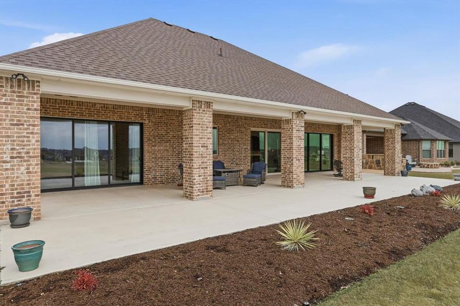 Spectacular Expanded Outdoor Living Pavilion with Prized Southern Exposure and commanding Panoramic Fairway Views from Tee to Green. Grand in scale, this Exceptional Space Accommodates Multiple Lounge and Entertaining Settings while delivering a True Resort-Style Experience at Home. Accessed from Great Room, Dining Area, and Primary Suite.