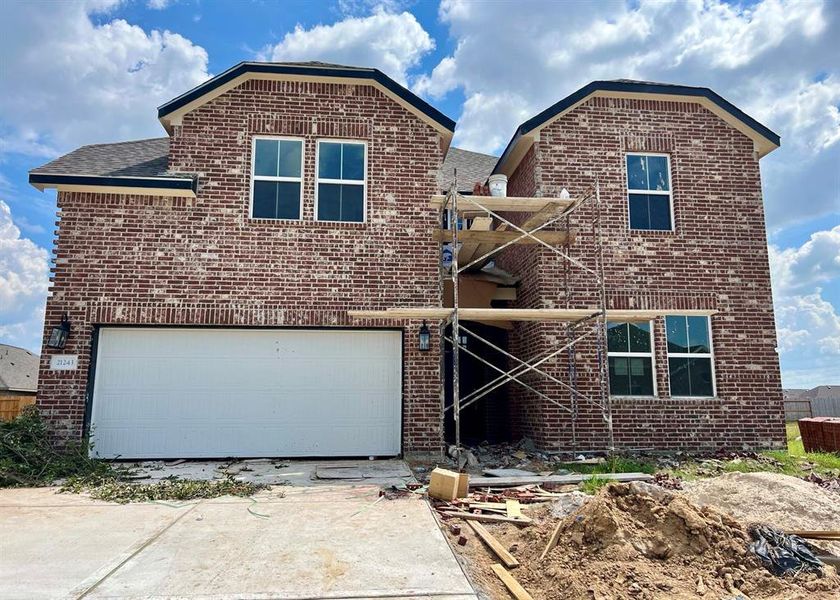 Two-story home with 5 bedrooms, 4.5 baths and 3 car tandem garage