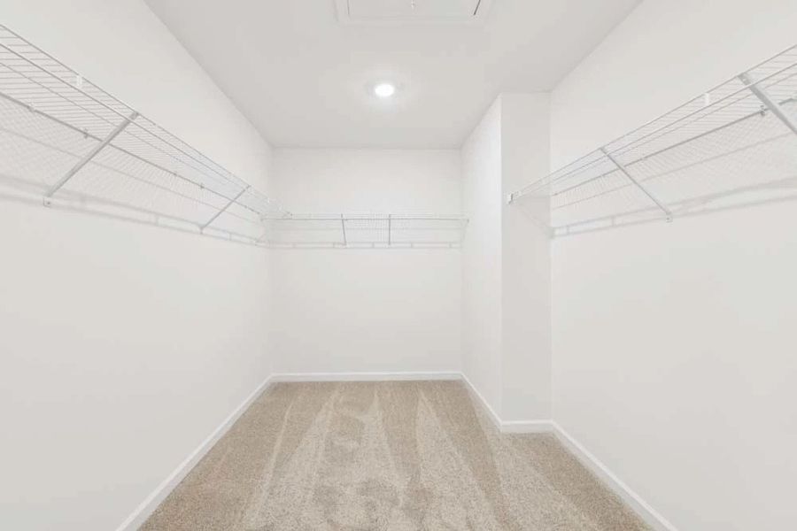 Sample Photo: Primary Bedroom Walk-In Closet Sample Photo: Primary Bedroom Walk-In Closet