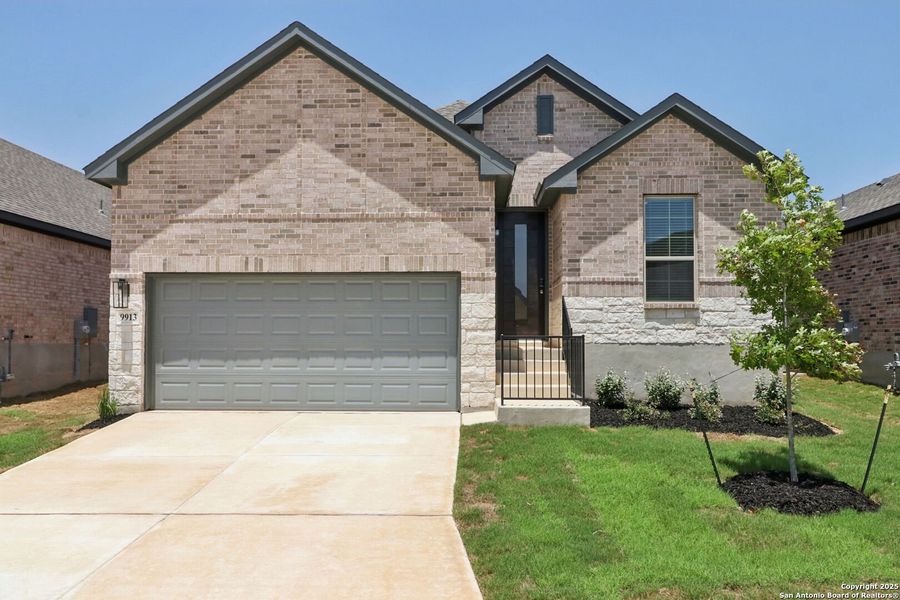 Front exterior of a new home in Arcadia Ridge - Premier Series, San Antonio, TX, highlighting curb appeal (Image 21). Front exterior of a new home in Arcadia Ridge - Premier Series, San Antonio, TX, highlighting curb appeal (Image 21).