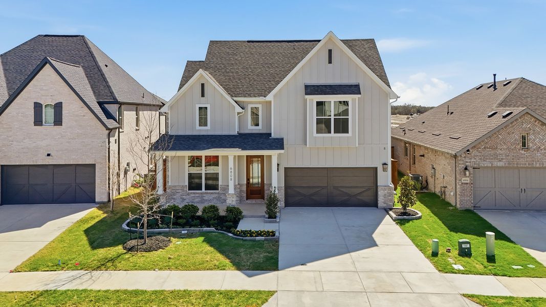 Front exterior of a new home in Aster Park, McKinney, TX, highlighting curb appeal (Image 24).