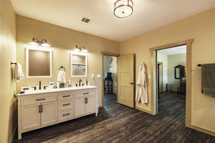 Primary ensuite bathroom enjoys double vanity and walk-in shower Primary ensuite bathroom enjoys double vanity and walk-in shower