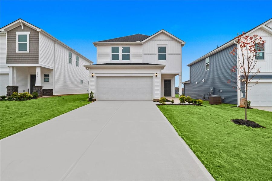 Front exterior of a new home in The Farm at Wells Creek - Heritage Collection, Gray Court, SC, highlighting curb appeal (Image 1). Front exterior of a new home in The Farm at Wells Creek - Heritage Collection, Gray Court, SC, highlighting curb appeal (Image 1).