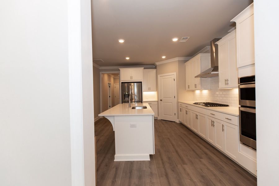 Representative furnished interior of a home built from the The Charleston by The Providence Group in Aberdeen, Hoschton (Image 13).