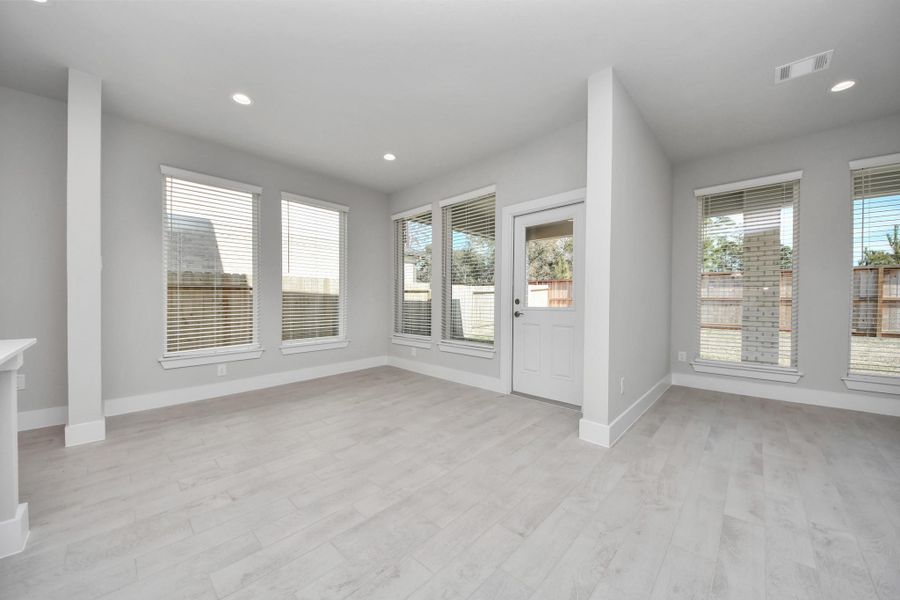 Make memories gathered around the table with your family and friends! This spacious dining room features elegant flooring, custom paint, and adjacent to family room and kitchen for open concept feel.