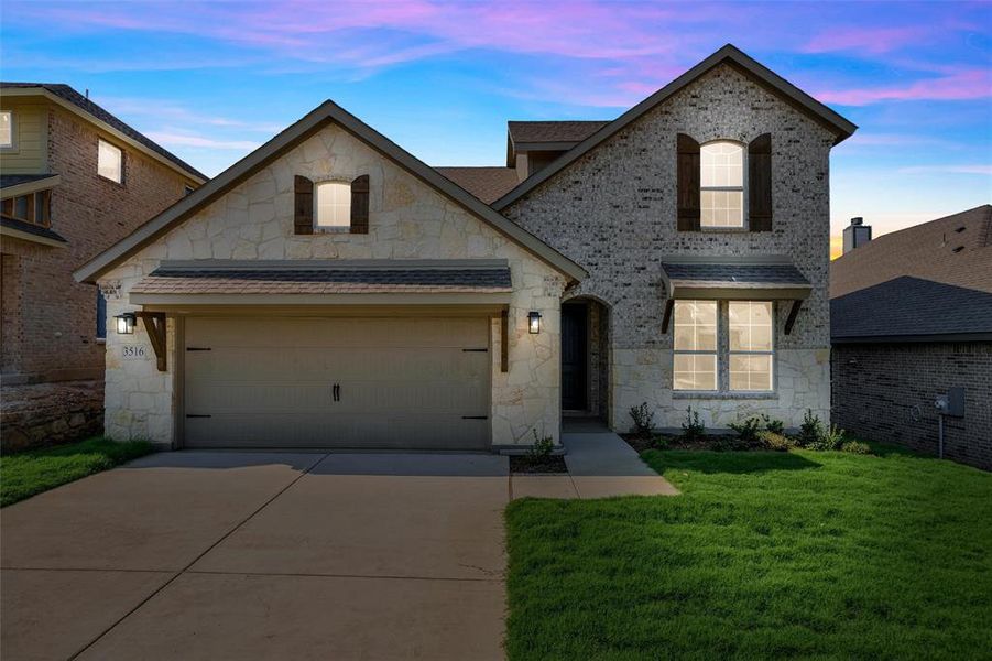 Front exterior of a new home in Liberty Pointe, Gainesville, TX, highlighting curb appeal (Image 24). Front exterior of a new home in Liberty Pointe, Gainesville, TX, highlighting curb appeal (Image 24).