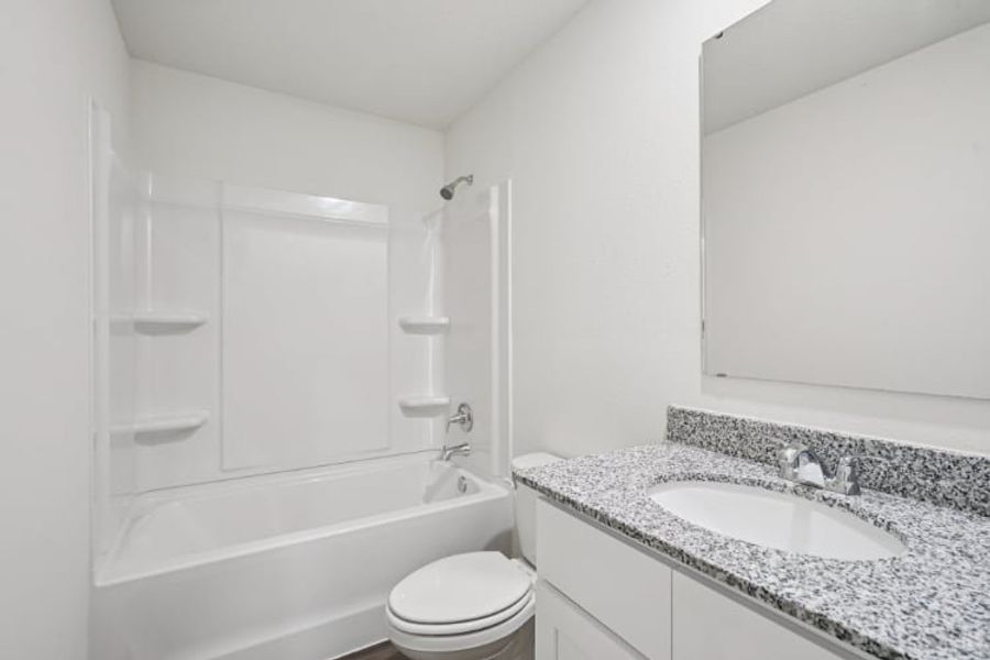 A bathroom with a sink and a bathtub.