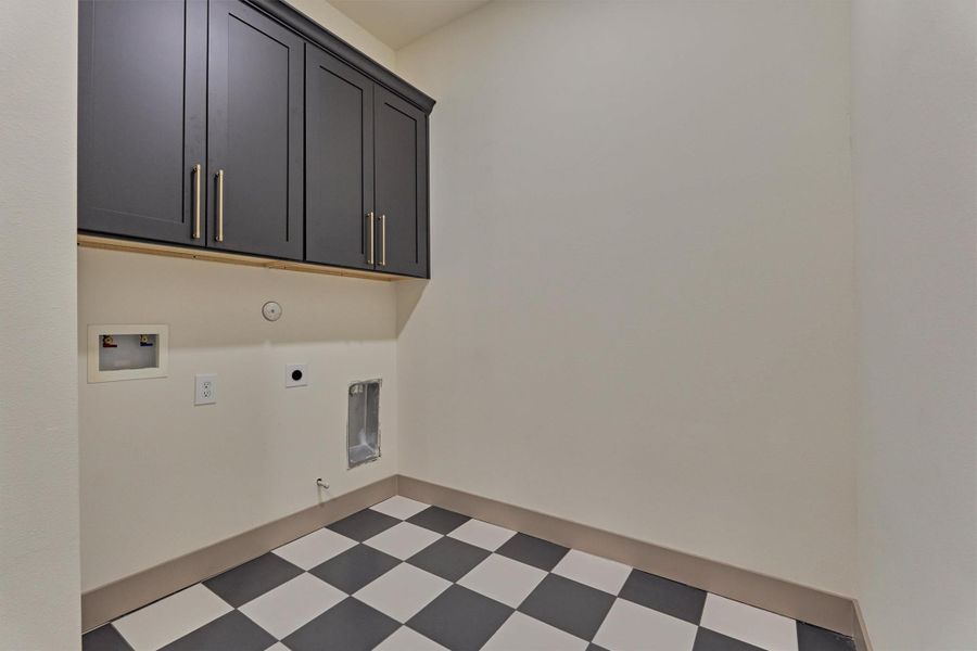 Spacious laundry room with additional storage